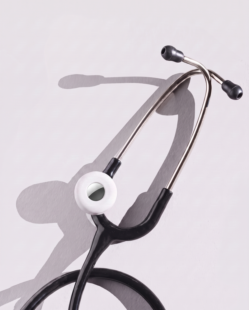 MotivatEM Stethoscope AirTag Holder in White on a black Littmann stethoscope